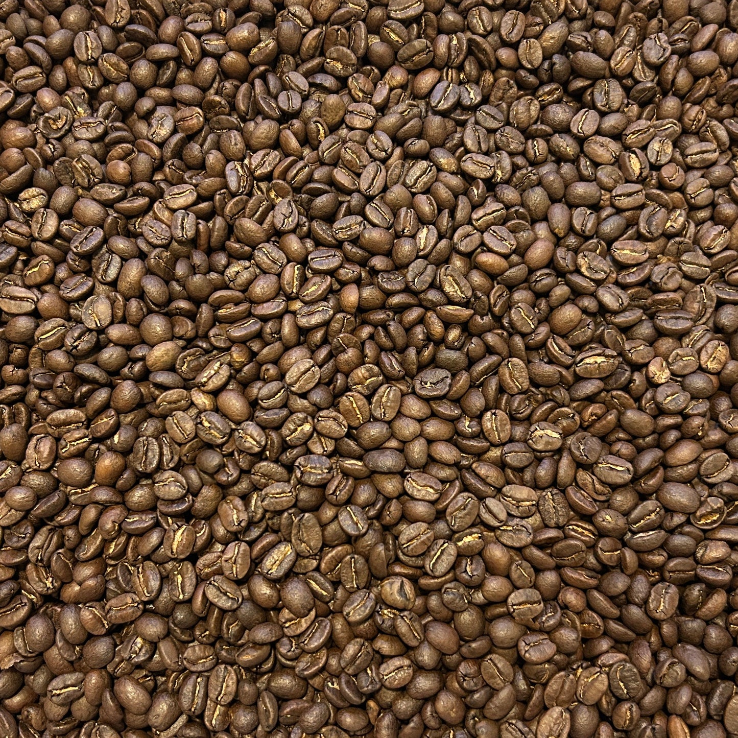 Container filled with coffee beans on a wooden surface