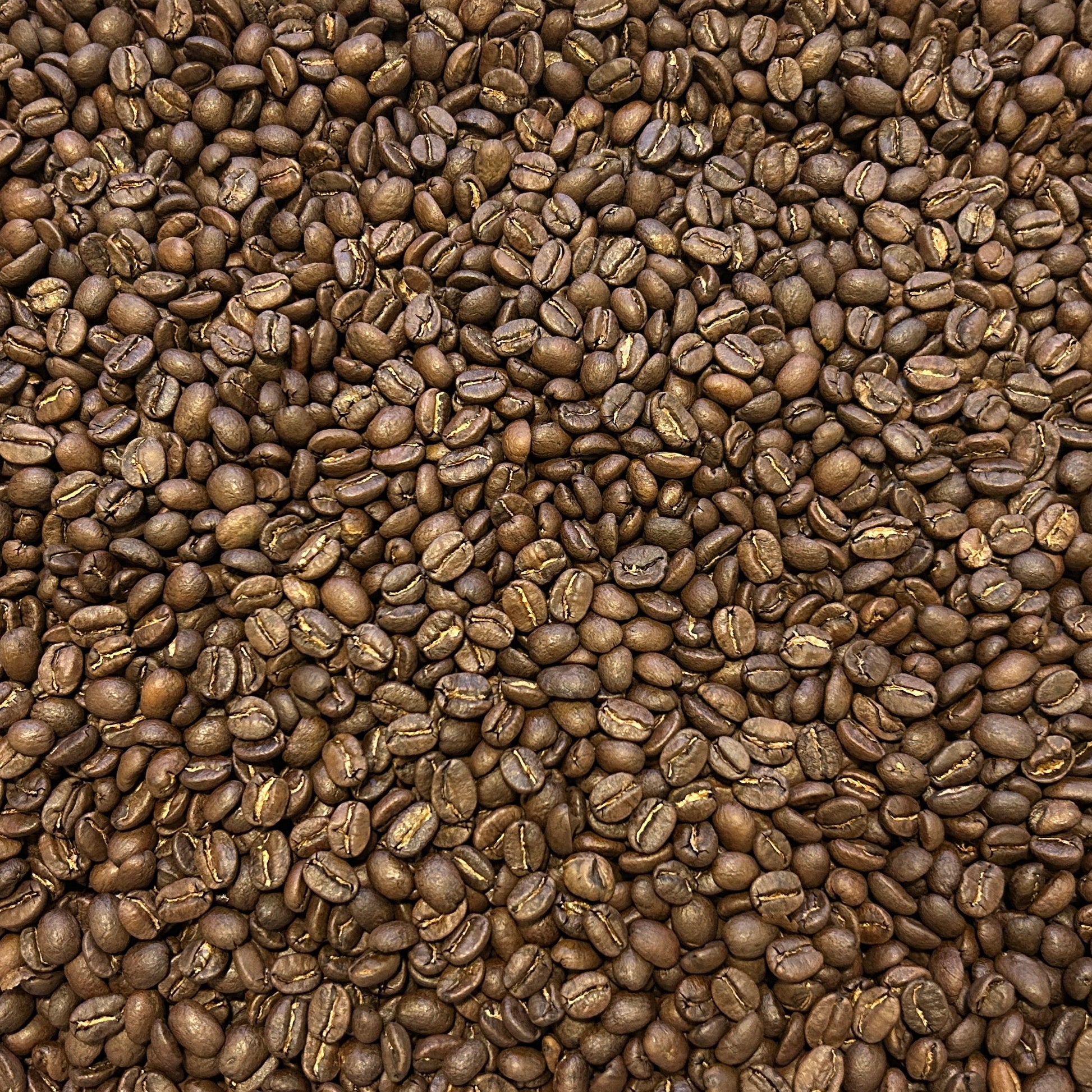 Container filled with coffee beans on a wooden surface